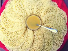 a plate with some food on it and a spoon