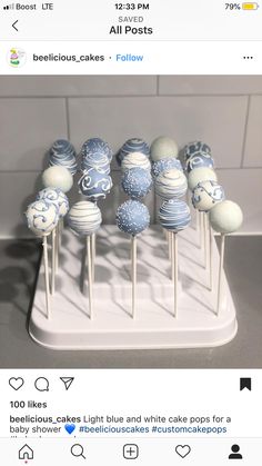 some blue and white cake pops on a stick