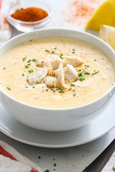 a white bowl filled with soup on top of a table