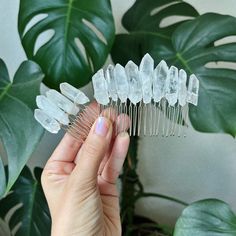 Cosmic clear quartz crystal combs.  The mini comb is only available on gold and silver combs. The big size is available on silver, gold, rose gold and black combs.  Big comb size: 3in Mini comb size: 1.5in To add a mini star and moon go here: http://etsy.me/2fsunMh To add large crescent moon go here: https://etsy.me/2Jp3dsu I am handcrafted with clear quartz crystal. I am sturdy, but please be gentle with me. Use bobby pins for extra reinforcement Crystal Wedding Decor, Feather Hair Comb, Early Spring Wedding, Crystal Hair Clip, Crystal Comb, Crown For Kids, Crystal Hair Accessories, Crystal Hair Clips, Crystal Hair Comb