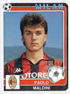 a soccer card with an image of a young man in red and black stripes on it