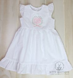 This stunning white seersucker dress is perfect for the spring and summer time. It comes with a custom monogram in an embroidered pink, mint, and lavender wreath. How to order: 1. Choose the size 2. In the personalization box, include the monogram in the order it's to be listed along with the font choice (if different from the listing picture) the font options can be found here: https://1drv.ms/u/s!AmQDetfCVjmkhcEeIMuNWdLzYlmlHw?e=JMxee4 Mint And Lavender, Pink White Dress, Lavender Wreath, Pink And White Dress, Seersucker Dress, Applique Shirts, Monogram Wreath, Girl Pattern, Custom Monogram