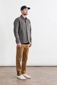 A classic button-up with two button flap chest pockets, the Eugene also features triple needle topstitching which gives it a workwear vibe. The workwear brown color way makes for an instant classic for any wardrobe. 100% Cotton Standard Fit Two notched-corner button closure chest pockets Machine wash cold in mild detergent with like colors. Line or tumble dry low. David is 6'0" and wearing size Medium. American Express Credit Card, Chore Coat, Twill Jacket, Charcoal Color, Range Of Motion, Chest Pocket, Brown Color, Wardrobe Staples, Cotton Canvas