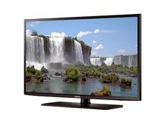 a flat screen tv with waterfall in the background