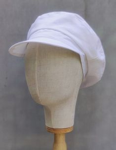 Introducing our Linen Newsboy Hat in crisp white -- a timeless accessory that combines style with functionality. Made from breathable linen, this hat is perfect for keeping you cool and comfortable on warm days. 🌾 Breathable Linen Construction: Crafted from high-quality linen fabric, our hat ensures optimal breathability, allowing air to circulate freely to keep you feeling fresh. 🧢 Lined for Comfort: The interior of the hat is lined, providing added comfort and a soft feel against your skin. Classic White Cloche Hat With Short Brim, White Linen Hats For Spring, White Linen Hat For Spring, White Flat Cap Hat One Size Fits Most, White Classic Cloche Hat For Summer, Classic White Cloche Hat For Summer, Lightweight White Hats For Spring, White Linen Casual Hat, Classic White Baseball Cap With Short Brim