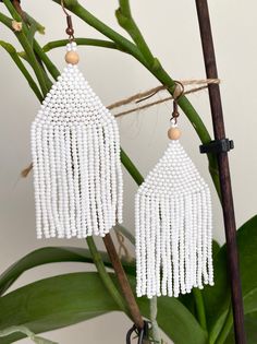 "White beaded earrings for your beautiful holiday look. These are a cute bohemian earrings made with love for you. It also makes an excellent gift for Easter, birthdays, anniversaries, mother's day, valentine's day and more. ♡ Bead Length - 8 cm (3'') ♡ Total Length - 9.5 cm (3,5\") ♡ Width - 3 cm (1\") ♡ Quality Czech beads ♡ Stainless steel mounts If you like these long seed beads earrings, but would like them in a different color please email me and I do special orders. I accept payments thro Elegant White Beaded Earrings With Colorful Beads, White Tassel Chandelier Drop Earrings, White Dangle Beaded Earrings With Tassels, White Colorful Beads Drop Tassel Earrings, White Colorful Beads Tassel Drop Earrings, White Tassel Drop Earrings With Colorful Beads, Bohemian White Tassel Earrings For Gift, Bohemian White Tassel Earrings As Gift, White Bohemian Tassel Earrings For Gift