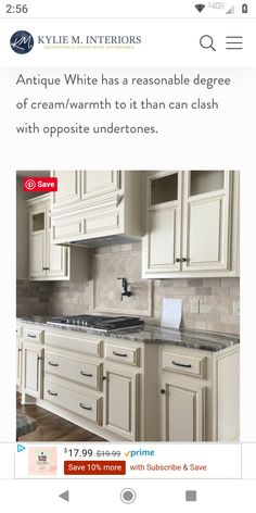 an image of a kitchen with white cabinets and granite counter tops on the bottom right corner