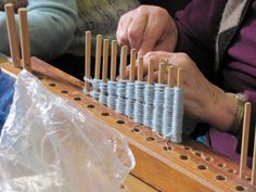 two people are working on an instrument together