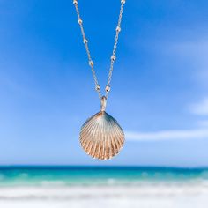 Wear your seashell and be reminded that with all the ups and downs that life brings, the waves will always bring you where you need to be. The gold shell charm has been cast from a seashell that washed up on the beach on the island of Nevis, West Indies. It has been cast into recycled 14k gold using the lost wax method and contains all the beautiful nooks and crannies of the original shell. Seashell Pendant: ~16mm recycled solid 14k yellow gold Chain: 14k gold satellite chain Due to the handmade Gold Shell Necklace With Starfish Charm On Strand, Coastal Style Gold Strand Jewelry, Shell-shaped Ocean-inspired Jewelry With Starfish Charm, Ocean-inspired Jewelry With Starfish Charm And Shell Shape, Gold Shell-shaped Necklace With Starfish Charm, Ocean-inspired Shell Jewelry With Starfish Charm, Yellow Gold Shell Jewelry For Beach, Gold Necklace With Starfish Charm, Beachy Gold Shell-shaped Jewelry