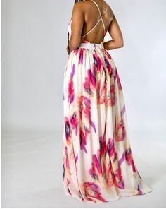 This fun and vibrant maxi dress is perfect to brighten up your warmth-weather wardrobe. Product Details: Model is 6” tall and wearing a medium Non-stretch dress V neck Sleeveless Adjustable straps X back Zipper closure 100% polyester Hand wash cold Floor length Runs a bit small