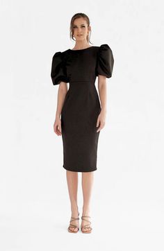 Alice is the perfect dress for a day in office followed by a dinner with friends. The puffed sleeves and V backline details make it stand out while its silhouette allows for an elegant and sophisticated look. Office compatible on its own but easy to dress it up with jewellery for after work.95% PE 5% SPModel is 5'9" tall and wears a size XS. Midi length Zip on the back Puffed sleeves Evening Puff Sleeve Dress With Structured Shoulders, Evening Puff Sleeve Dress With Structured Bishop Sleeves, Chic Fitted Puff Sleeve Dress With Bishop Sleeves, Formal Midi Dress With Structured Balloon Sleeves, Formal Midi Dress With Balloon Sleeve And Structured Shoulders, Fitted Puff Sleeve Dress With Draped Sleeves For Evening, Elegant Midi Dress With Lantern Sleeves For Night Out, Chic Fitted Puff Sleeve Dress With Balloon Sleeves, Elegant Lantern Sleeve Midi Dress For Night Out