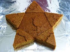 a star shaped cookie sitting on top of aluminum foil