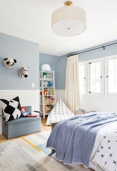 a bedroom with blue walls and white furniture in the room is featured on instagram