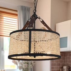 a chandelier hanging from the ceiling in a kitchen