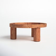 a wooden table sitting on top of a white floor