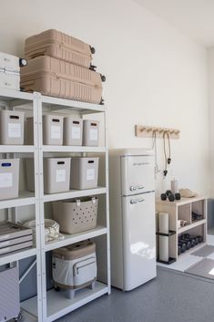 the shelves are filled with many different types of storage containers and bins on them