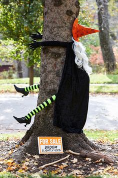 a tree with a halloween decoration on it