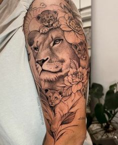 a woman with a lion tattoo on her arm