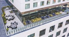 an aerial view of a building with tables and chairs