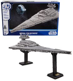 a model of the imperial star destroyer is shown in its box and it's ready to be put on display