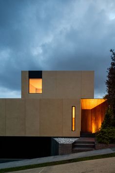 an exterior view of a modern house at dusk