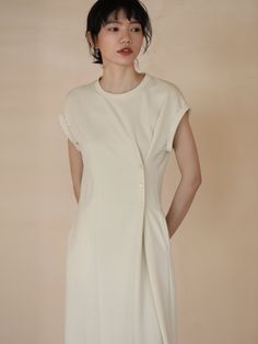 A dress with a unique silhouette that has buttons at the waist and the fabric is gathered together. The design looks like the sleeves are rolled up and folded back. A casual item that can be worn on vacation. 
 
 
 
 
 
 
 
 
 
 
 
 
 
 
 
 Size 
 
 
 S size 
 
 
 Length: 105.5cm 
 Bust: 104cm 
 Sleeve length: 16cm 
 
 M size 
 
 Length: 107cm 
 Bust: 108cm 
 Sleeve length: 16.5cm 
 
 L size 
 
 Length: 108.5cm 
 Bust: 112cm 
 Sleeve length: 17cm 
 
 XL size 
 
 Length: 110cm 
 Bust: 116cm 
 Sle Summer Dresses With Button Back And Short Sleeves, Chic Short Sleeve Button Back Dress, Chic Short Sleeve Dress With Button Back, Beige Short Sleeve Mini Dress With Buttons, Knee-length Dresses With Rolled Sleeves For Daywear, Knee-length Daywear Dresses With Rolled Sleeves, Button Back Mini Dress For Day Out, Chic Knee-length Dresses With Rolled Sleeves, Button-back Dresses For Daywear