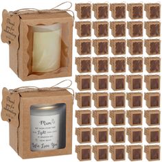 a candle in a cardboard box next to some chocolate squares on the packaging and labels