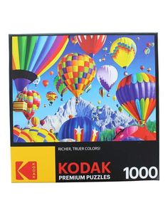 a puzzle box with colorful hot air balloons in the sky