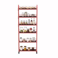 a red metal shelf filled with lots of different types of spices and condiments