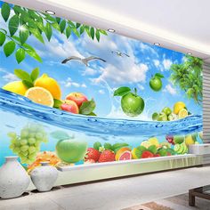 a wall mural with fruit and seagulls in the ocean on it's side