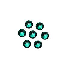 six green crystal stones on a white background