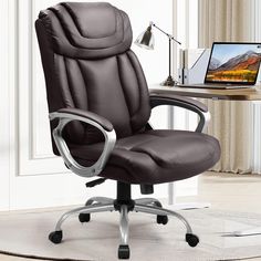 a brown office chair sitting in front of a desk with a laptop computer on it