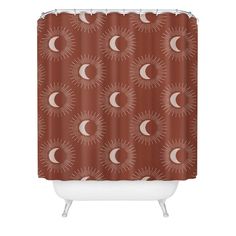 a shower curtain with the sun and moon on it