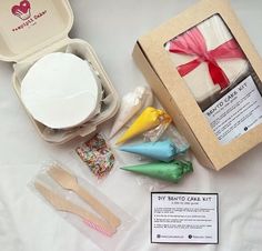 the contents of a cake kit are laid out on a table