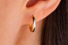 Our enameled earring is 14k solid gold and it has black and white color together. These earrings are made with meticulous workmanship enameled art that looks vivid. It is a delicate hoop earring that anyone can use from 7 to 70.  Our enameled circle earring's inner diameter is 12.74 mm, the outer diameter is 13.60 mm, the thickness of the earring is 1.44 mm, and the width of the earring is 2.05 mm. This patterned gold modern earring completes your all outfit in a day. So, it will accompany you at any time of the day, thanks to its dainty and minimalist style. The lock part of our earring is very useful, the most important feature of a lock system is that the lock part is positioned inside the earring in a way that does not disturb you at all. You can make happy your loved ones with this 14 Dainty Polished Hoop Earrings As Gift, Minimalist Hoop Earrings With Shiny Finish As Gift, Everyday Fine Jewelry White Hoop Earrings, White Fine Jewelry Hoop Earrings For Everyday, White 14k Gold Huggie Earrings As Gift, Classic White Huggie Earrings For Everyday, Dainty White 14k Gold Hoop Earrings, Everyday Fine White Hoop Earrings, White Fine Jewelry Huggie Earrings As Gift