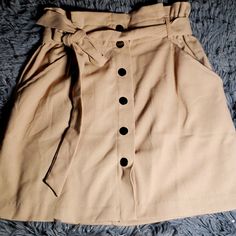 Nwt Button Skirt With Belt Super Cute Has Front Pockets Aswell Adorable Skirt Button Clips Size Small Color Khaki/Tan Brown Mini Skirt With Button Closure For Work, Button-up Mini Skirt With Pockets For Work, Summer Workwear Button-up Mini Skirt, Casual Skort With Button Closure For Work, Workwear Mini Skort With Button Closure, Spring Mini Skirt With Button Closure For Work, Trendy Mini Skirt With Buttons For Work, Casual Beige Mini Skirt With Button Closure, Chic Mini Skirt With Snap Buttons