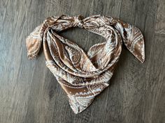 Color: Taupe Tan and Off white large paisley Size: 19"x19", 35"x35", 27"x27", 40"x40", or 44"x44"  Material: Polyester Weight: Lightweight and Silky Soft Hem: Rolled (not surged) Western Neck Scarf, Wild Rags, Double B, Wild Rag, Cowboy Western, Neck Scarf, Neck Scarves, Western Cowboy, Scarf Wrap