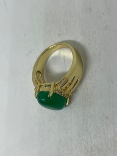 Vintage Lucky Green Nephrite Jade Gold Filled Cocktail Ring Large green nephrite jade gold filled Vintage ring, does not tarnish Size 5.5, 6, 7, 7.5, 8 All rings are shipped free in the US in a nice gift box. Check out our over a THOUSAND great reviews Engraving is $4 per letter and is not always perfect depending on the piece. It can take a few days if the jeweler is busy. This is payable to Paypal Judithsltd@gmail.com Green Dome Ring As A Gift, Fine Jewelry, Gold Chrysoprase Ring, Formal Gold Emerald Chrysoprase Ring, Gold Formal Emerald Ring With Chrysoprase, Gold Jade Emerald Ring, Green Oval Gemstone Dome Ring, Gold Oval Chrysoprase Emerald Ring, Formal Gold Jade Rings, Gold Jade Cabochon Rings