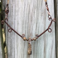 Stunning Woven Copper Necklace with Picasso Jasper and Copper Beads on a Silk Ribbon Cord. The Silk cord and handmade clasp measure 15 1/2" and the woven copper component is approximately 4" long 5" wide. This piece has been antiqued, polished and sealed. Sealed with Protectaclear. ProtectaClear is a clear, protective coating that is tough enough to protect jewelry and is safe for wear against skin. ProtectaClear is practically invisible once applied and will seal and protect jewelry from tarnis Bohemian Brown Electroformed Necklaces, Bohemian Brown Necklace With Copper Wire, Bohemian Brown Copper Wire Necklace, Earthy Adjustable Wire Wrapped Necklaces, Adjustable Earthy Jasper Necklaces, Adjustable Earthy Jasper Necklace, Earthy Brown Hand Wrapped Necklaces, Nature-inspired Brown Hand Wrapped Necklaces, Adjustable Wire Wrapped Nature-inspired Necklace