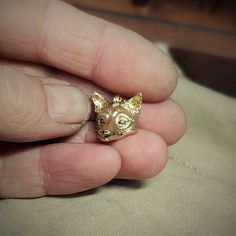 This piece will be hand made for you in the United Kingdom. Please allow up to 30 days for it to be completed. Gold fox head pendant and chain with diamond eyes.Immediately recognizable with their upright triangular ears, a pointed, slightly upturned snout, and long bushy tail, foxes are found on every continent except Antarctica. The global distribution of foxes, together with their widespread reputation for cunning, has contributed to their prominence in popular culture and folklore in many societies around the world.The yellow gold fox is made from 9ct gold that has been given a high-carat gold coating. The fox measures around 2cm (which is a little over three quarters of an inch). It has eyes made from natural, brilliant cut, approx 2.3mm wide, champagne coloured diamonds. The fox has Coloured Diamonds, Fox Necklace, Gold Fox, Foxes Necklace, Fox Head, Diamond Eyes, Charm Necklace Silver, Solid Gold Chains, Champagne Color