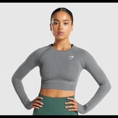 Endeavour To Perform In The Vital Seamless 2.0 Long Sleeve Crop Top. Look And Feel At Your Best In The Gym With An Elegant Crop And Form-Enhancing Fit Combined With Sweat-Wicking Technology And Supportive Fabrics. A Versatile Addition To Your Workout Wardrobe In A Variety Of Colours To Choose From. - Body Fit - Midriff Crop - Detailed With Figure-Contouring Shades - Sweat-Wicking Fabric - Heat Seal Logo At Left Chest - 96% Nylon 4% Elastane - Sku: B1a3d-Gbc7 Gymshark Cropped Long Sleeve, Gymshark Vital Seamless Long Sleeve, Gymshark Vital Seamless, Athletic Crop Top, Grey Crop Top, Gymshark Women, Seamless Leggings, Long Sleeve Crop, Grey Shirt