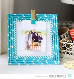 a blue frame with white polka dots on it