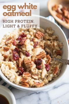 an egg white oatmeal with nuts and cranberries in a bowl