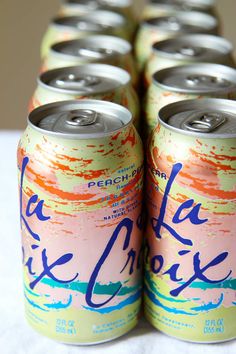 six cans of peach lemonade are stacked on top of each other