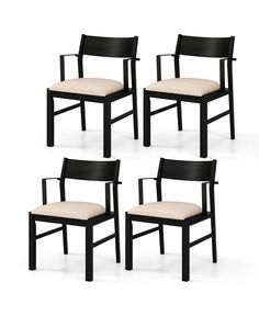 four black chairs with beige upholstered seats on each side and one in the middle