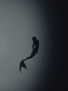 the silhouette of a woman floating in the air