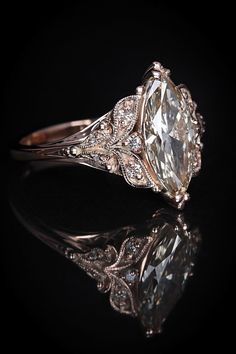 a fancy engagement ring with an oval cut diamond