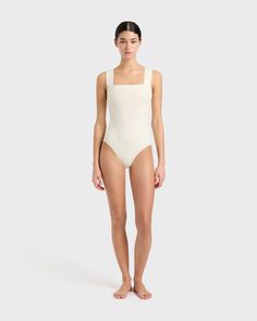 The Gwen One Piece swimsuit in Pearl features a minimal square neckline, wide comfortable straps, invisible under-bust support, removable cups and flattering gathers at the side bust. Gwen is made using our technically advanced Sculpteur® fabric that flatters and supports the silhouette. Luxury fabric sustainably made in Italy.Garment sustainably made in Australia. Square Neck Swimsuit, Luxury Swimsuits, Unique Beauty Products, Luxury Fabric, Designer Swimwear, Pearl Size, Large Bust, Black Rose, Luxury Fabrics