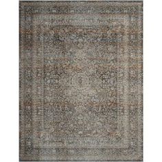 an area rug with various colors and patterns on the carpet, including blue, brown, beige