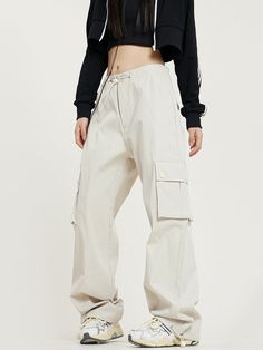 5ft 4''(166cm) tall, 95 lbs(43kg) weight and wearing a size S - Straight fit- Multi-pocket- Drape style- 2 colors White Baggy Pants For Outdoor, Beige Full-length Parachute Pants For Streetwear, White Baggy Cargo Pants With Hip Pockets, White Techwear Bottoms For Outdoor, Functional White Bottoms With Pockets, White Bottoms With Pockets For Outdoor Activities, White Full-length Cargo Jeans With Pockets, White Wide Leg Bottoms For Outdoor, White Wide-leg Bottoms For Outdoor